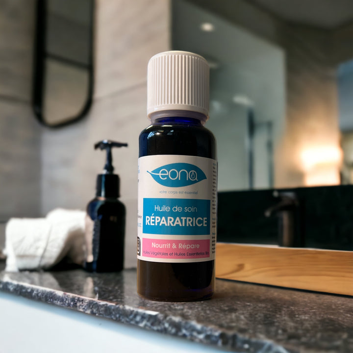 huile de soin reparatrice dans salle de bain